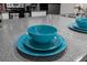 Close-up view of kitchen counter with teal dishware at 3163 Britannia Blvd # D, Kissimmee, FL 34747