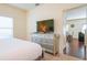 Bedroom with a dresser and view of the living area at 3201 Gold Ln, Kissimmee, FL 34747