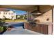 Community outdoor kitchen with grill and seating at 3201 Gold Ln, Kissimmee, FL 34747