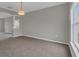 Dining room with gray walls, neutral carpet, and a window with natural light at 370 Aldershot Ct, Kissimmee, FL 34758