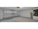 Spacious garage with tall ceilings offers ample storage and parking at 370 Aldershot Ct, Kissimmee, FL 34758