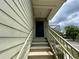 Inviting entryway featuring stairs leading to the unit door with neutral color and railings at 3721 S Lake Orlando Pkwy # 2, Orlando, FL 32808