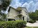 Inviting two-story condo featuring private entry, lush landscaping, and tranquil surroundings at 3721 S Lake Orlando Pkwy # 2, Orlando, FL 32808