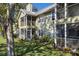 Apartment building with screened porches and landscaped lawn at 3721 S Lake Orlando Pkwy # 2, Orlando, FL 32808