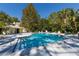 Inviting community pool featuring sun loungers and lush tropical landscaping at 3721 S Lake Orlando Pkwy # 2, Orlando, FL 32808