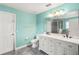 Elegant bathroom with double vanity, large mirror, and a shower at 3969 Lone Eagle Pl, Sanford, FL 32771