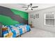 bedroom with full-size bed and green/gray decor at 3969 Lone Eagle Pl, Sanford, FL 32771