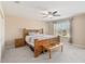 Main bedroom with wooden bed frame and a ceiling fan at 3969 Lone Eagle Pl, Sanford, FL 32771