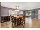 Dining room with a wooden table and six chairs, near living room at 3969 Lone Eagle Pl, Sanford, FL 32771