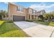 Two story house with a large driveway and green lawn at 3969 Lone Eagle Pl, Sanford, FL 32771