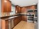 Modern kitchen features stainless steel appliances and ample wood cabinetry at 3969 Lone Eagle Pl, Sanford, FL 32771