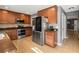 Modern kitchen with stainless steel appliances and wood cabinets at 3969 Lone Eagle Pl, Sanford, FL 32771