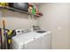 Laundry room with washer, dryer, and overhead storage at 3969 Lone Eagle Pl, Sanford, FL 32771