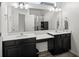 Bathroom boasts double vanity, and large mirror at 3999 Night Heron Dr, Sanford, FL 32773