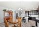 Dining area with a round table and chairs, adjacent to the kitchen at 3999 Night Heron Dr, Sanford, FL 32773