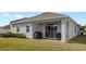 Single story house, covered patio, grassy yard at 3999 Night Heron Dr, Sanford, FL 32773