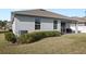 Single-story home with a covered patio and landscaped yard at 3999 Night Heron Dr, Sanford, FL 32773