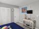 Bedroom with a bed, side table, closet, and a wall mounted television at 400 Auburn Dr # 3, Daytona Beach, FL 32118