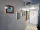 Hallway featuring decorative art and a view of the front door at 400 Auburn Dr # 3, Daytona Beach, FL 32118