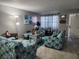 Living room with nautical themed couches, chairs, a table and tile floors at 400 Auburn Dr # 3, Daytona Beach, FL 32118