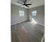 Spacious bedroom with gray flooring and neutral walls at 4072 Shellman St, Orlando, FL 32811