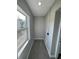 Bright laundry room with gray vinyl flooring and a window at 4072 Shellman St, Orlando, FL 32811