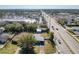 Aerial view showing house location near a busy road and businesses at 4400 Southmore Dr, Orlando, FL 32812