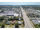 Aerial view showing home's location near a main road and businesses at 4400 Southmore Dr, Orlando, FL 32812