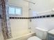 Clean bathroom, shower/tub combo, tile surround, and vanity at 4400 Southmore Dr, Orlando, FL 32812