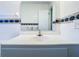 White vanity with a round sink in a tiled bathroom at 4400 Southmore Dr, Orlando, FL 32812