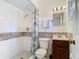 Bathroom with shower, toilet, and wood vanity at 4400 Southmore Dr, Orlando, FL 32812