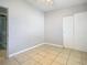 Bedroom with tile floors and access to bathroom at 4400 Southmore Dr, Orlando, FL 32812