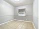 Small bedroom with tile floors and window at 4400 Southmore Dr, Orlando, FL 32812