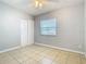 Bedroom with tile floors, window, and ceiling fan at 4400 Southmore Dr, Orlando, FL 32812