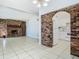 Dining room with tiled floors, chandelier, and brick accent wall at 4400 Southmore Dr, Orlando, FL 32812