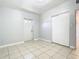 Bright entryway with tile flooring, closet, and exterior door at 4400 Southmore Dr, Orlando, FL 32812