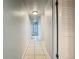 Clean hallway with tile flooring and light fixture at 4400 Southmore Dr, Orlando, FL 32812