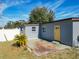 House exterior with yellow door and patio at 4400 Southmore Dr, Orlando, FL 32812