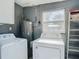 Laundry room with washer, dryer, and water heater at 4400 Southmore Dr, Orlando, FL 32812