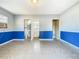 Living room with blue wainscoting and tile flooring at 4400 Southmore Dr, Orlando, FL 32812