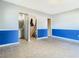 Living room with blue wainscoting and tile flooring at 4400 Southmore Dr, Orlando, FL 32812