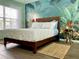 Bedroom with a wicker headboard, light blue bedding, and a tropical mural at 4560 Yellowgold E Rd # 108, Kissimmee, FL 34746