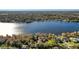 Aerial view of lakefront home nestled in a tranquil setting at 491 Carolyn Dr, Oviedo, FL 32765