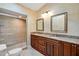 Elegant bathroom with double vanity, granite countertop, and large shower at 491 Carolyn Dr, Oviedo, FL 32765