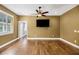 Spacious bedroom with hardwood floors and a TV mount at 491 Carolyn Dr, Oviedo, FL 32765