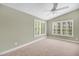 Bedroom with vaulted ceiling, carpet and window shutters at 491 Carolyn Dr, Oviedo, FL 32765