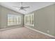 Bright bedroom with vaulted ceiling, carpet, and window shutters at 491 Carolyn Dr, Oviedo, FL 32765