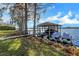 Covered boat dock with lift and space for jet skis at 491 Carolyn Dr, Oviedo, FL 32765