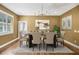 Elegant dining room with chandelier and hardwood floors at 491 Carolyn Dr, Oviedo, FL 32765