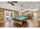 Game room with pool table, kitchen, and access to backyard at 491 Carolyn Dr, Oviedo, FL 32765